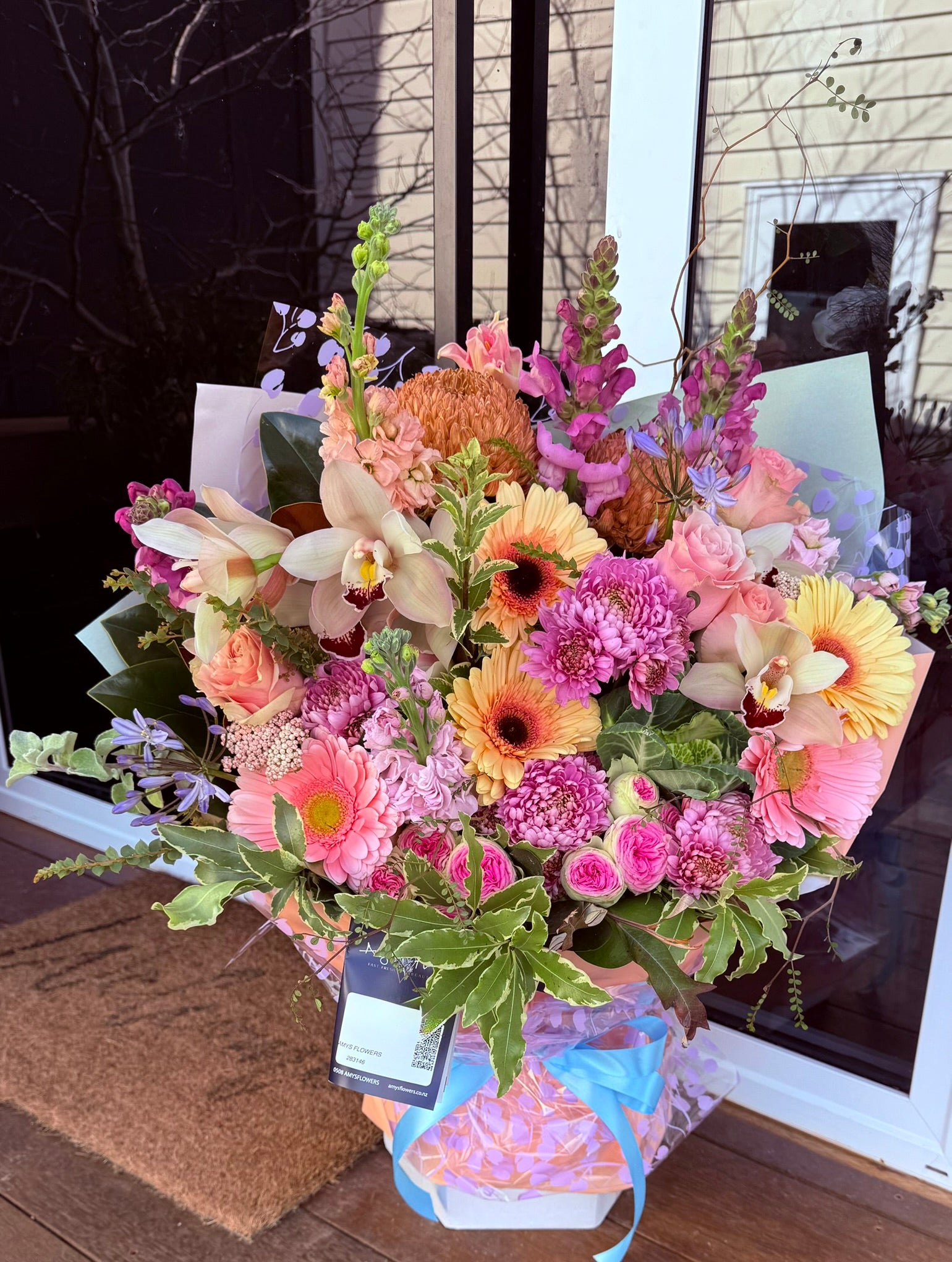 A colourful arrangement made by Amy's Flowers